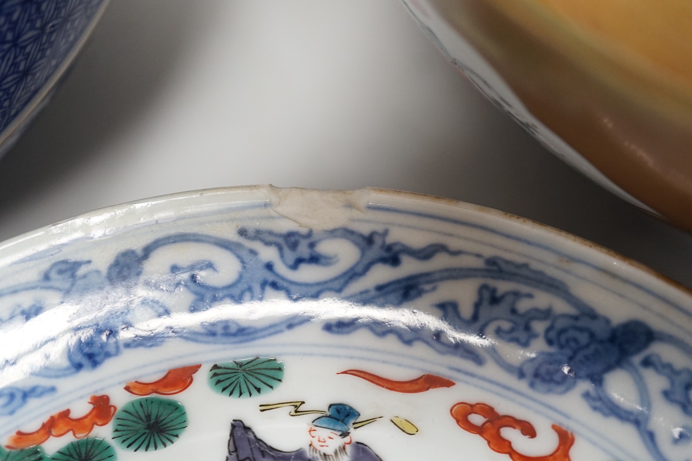 A group of Japanese and Chinese ceramics to include two blue and white jars, a wucai bowl etc.